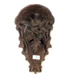 A Black Forest carved Pine bird and leaf wall bracket,