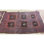 A Persian rug with six central medallions,