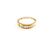 A 14ct Gold white stone set channel ring,