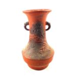 A red clay dragon moulded vase,