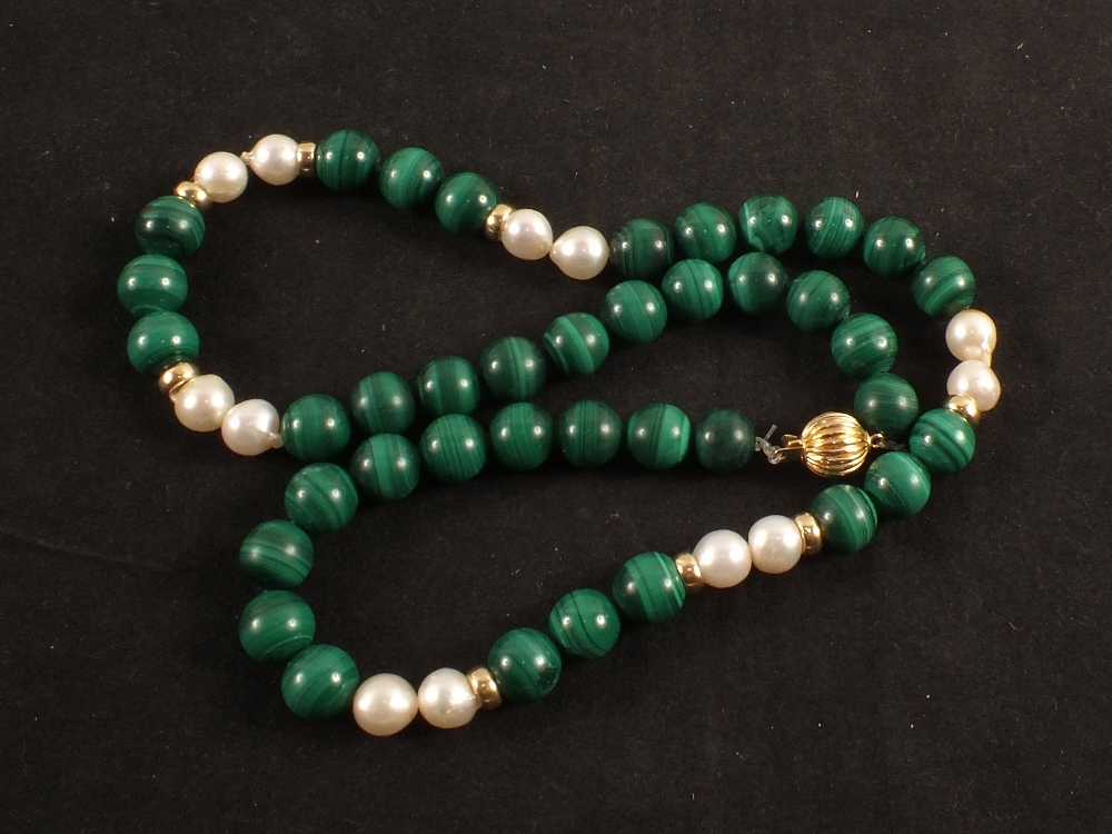 A Malachite and Pearl necklace interspaced with Gold beads with 14K Gold clasp