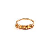 A 9ct Gold orange stone set ring,