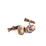 A pair of white metal Egyptian revival cufflinks with Pharaoh enamelled decoration