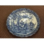 A Japanese blue and white figure decorated shaped edge charger,