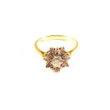An 18ct Gold Diamond set ring of flower form,
