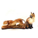 A pottery sitting cat, height 13" and a pottery big cat hunting,