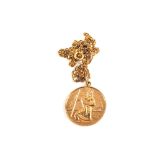 A large 9ct Gold St Christopher pendant on yellow metal chain,