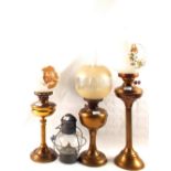 Three various Brass oil lamps plus a storm lantern