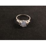 A White Gold star Sapphire and diamond ring, stamped 18K,