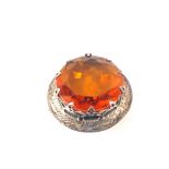 A Scottish Silver brooch set with an orange stone