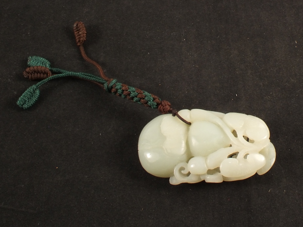 A Chinese carved Jade peach pendant