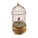 A singing bird automation in Brass domed case,