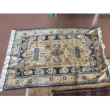 A Persian pattern blue ground rug,