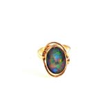 A Gold ring set with coloured stone,