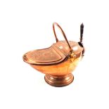 A heavy Victorian embossed Copper and Brass coal scuttle of helmet shape with hinged cover, liner,