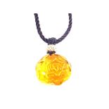 A Chinese Amber flower pendant