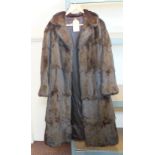 A lady's dark brown mink coat