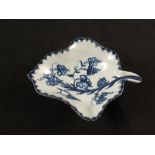 A Lowestoft blue and white pickle dish with relief moulded body and floral and grape decoration,