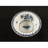 A Lowestoft blue and white patty pan with floral, insect and berry pattern border decoration,