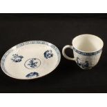 A Lowestoft blue and white relief moulded Hughes style cup and saucer with chinoiserie landscape