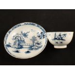 A Lowestoft blue and white Long Fence pattern tea bowl and saucer with house and bridge decoration