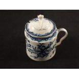 A Lowestoft blue and white mustard pot and cover with floral Mansfield pattern decoration,