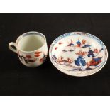 A Lowestoft red and blue doll's house pattern cup and saucer,