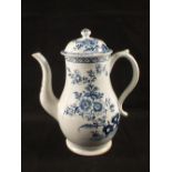 A Lowestoft blue and white coffee pot and cover with rock and floral decoration, height 9"