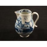 A Lowestoft blue and white sparrow beak jug with two house on island decoration,