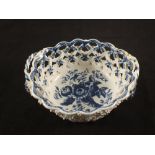 A Lowestoft blue and white chestnut basket with floral pine cone decoration, 7 1/2" x 6 1/2",