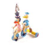 An early 1940's Frenchvilette Donald Duck plus passenger pull along toy