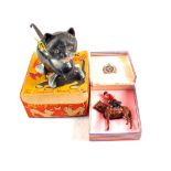 A boxed Triang Minic kitty and butterfly plus a boxed die cast Queen Elizabeth mounted on horse