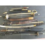 A collection of swords etc including Japanese Civilian Katana daggers,