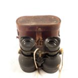 A pair of WWI era military binoculars in leather case