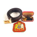 A Royal Norfolks belt and a pair of cufflinks