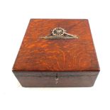 A part fitted Oak box with a white metal Artillery emblem to lid