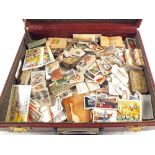 A case of various cigarette cards