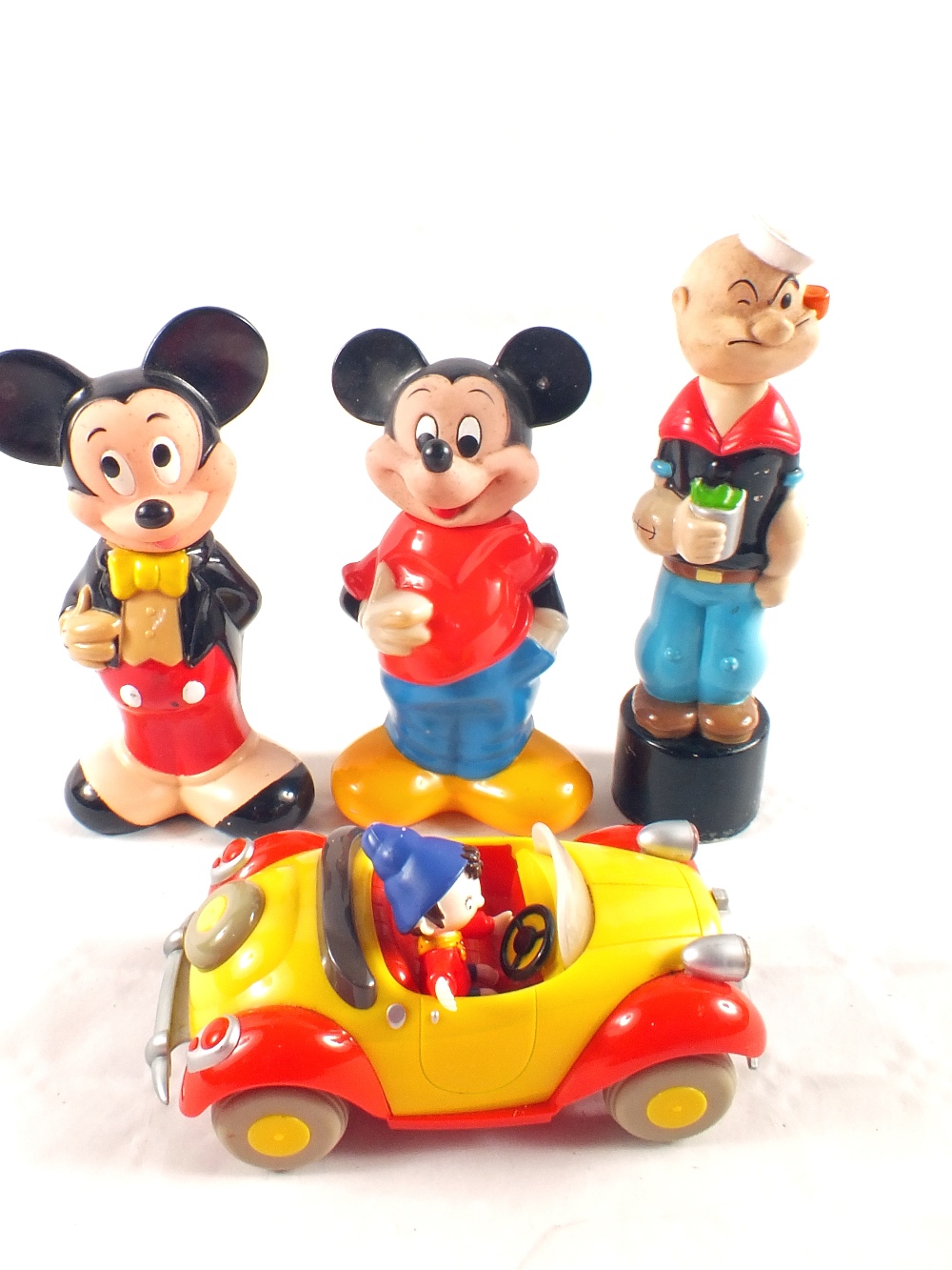 A battery operated Noddy in his car plus three Disney characters (one Popeye and two Mickey Mouse)