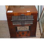 A wooden cased HMV mains radio