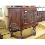 An Old Charm carved oak Credence style cupboard