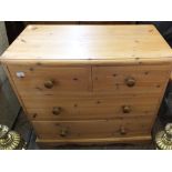 A pine chest of two short and two long drawers, height 34", width 36",