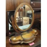 A Victorian oval mahogany swing toilet mirror