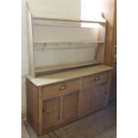 A Victorian pine shelf back dresser