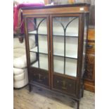 An Edwardian inlaid and painted two door china cabinet