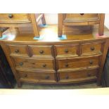 A modern walnut bow front chest of six drawers, height 33", Width 51",