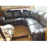 A large brown leather corner settee (six seater)