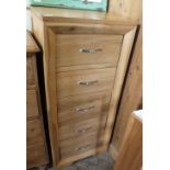 A modern light oak narrow chest of five drawers, height 47", width 20 1/2",