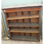 A mahogany four shelf floor standing bookcase