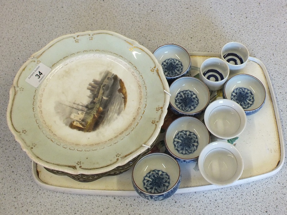 A 19th Century painted plate Raddlam Castle Flintshire and other plates plus Japanese Saki bowls