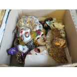 A large quantity of porcelain and other masks (two boxes)